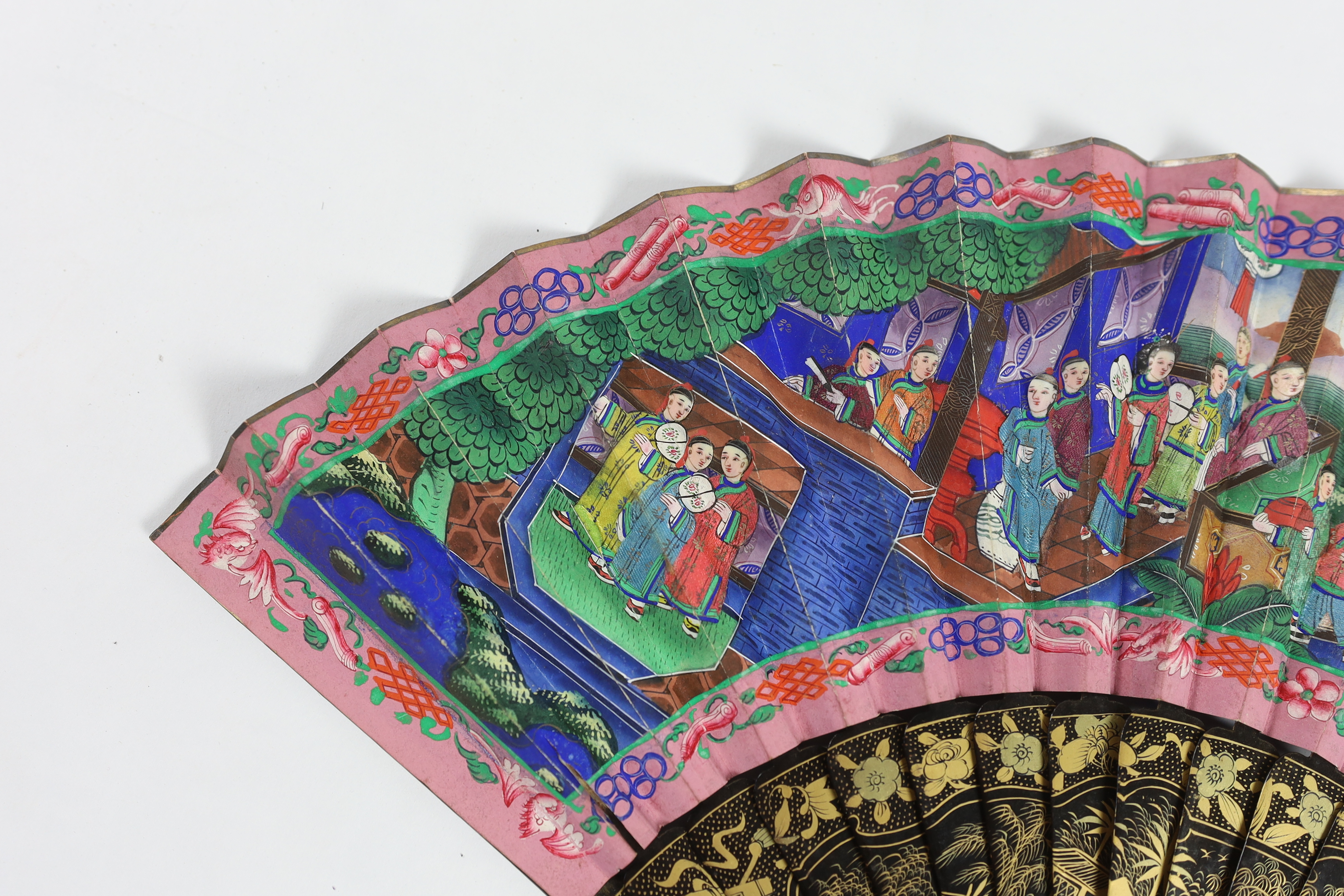 A 19th century Chinese ornately lacquered and hand painted figural leaf fan, the figures on the leaf having painted ivory faces, the back of the fan painted with exotic birds and flowers, CITES Submission reference TJUZX